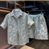 S19b17d3c07154d0d8aed749b337fe262o.jpg Ethnic Style Embossed Gold-hot Flower Short-sleeved Shirt and Shorts Two-piece Set Men Summer Loose Black Gold Shirt Set