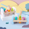 S74c64240aa0b40e2b40b89bf0dd4d69a7.jpg Wooden Colorful Pounding Toy Features assorted colorful pegs and a wooden hammer Kids have a blast hammering away