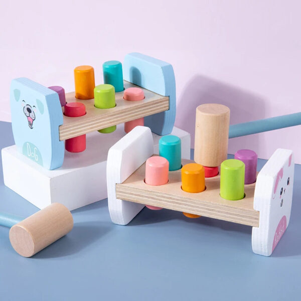 S75bb65b0e6654f48a2e38d8571c6ec3cX.jpg Wooden Colorful Pounding Toy Features assorted colorful pegs and a wooden hammer Kids have a blast hammering away