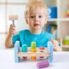 S7891f6986add42529239d3f7c729f018M.jpg Wooden Colorful Pounding Toy Features assorted colorful pegs and a wooden hammer Kids have a blast hammering away
