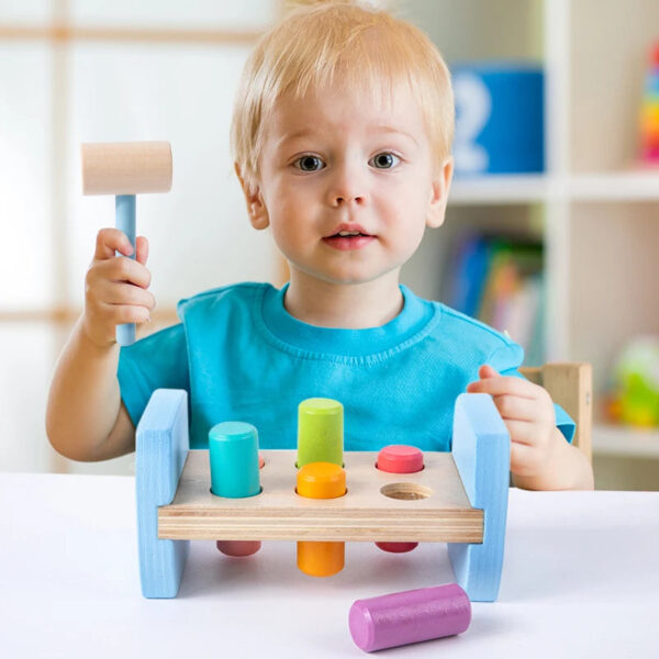 S7891f6986add42529239d3f7c729f018M.jpg Wooden Colorful Pounding Toy Features assorted colorful pegs and a wooden hammer Kids have a blast hammering away