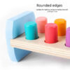S868e86b664ce48dd90e04133033e7a16g.jpg Wooden Colorful Pounding Toy Features assorted colorful pegs and a wooden hammer Kids have a blast hammering away