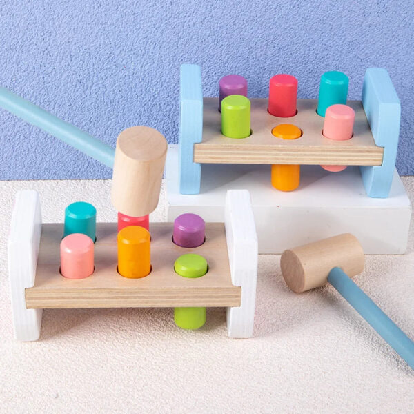 Sba3ae99313ce4e269c8db5b328d3cb02N.jpg Wooden Colorful Pounding Toy Features assorted colorful pegs and a wooden hammer Kids have a blast hammering away